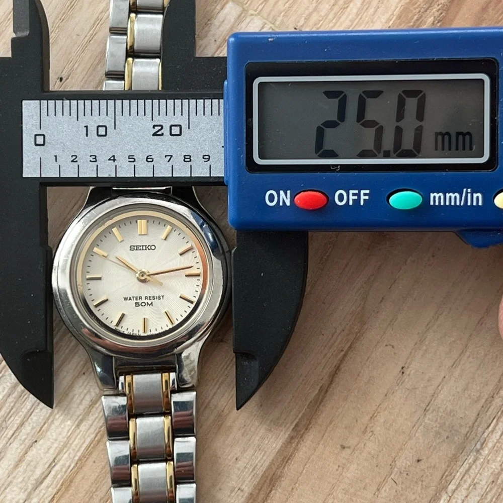 Seiko Ladies Watch Spiral Stainless Dial Gold-Tone Markers Two-Tone Bracelet